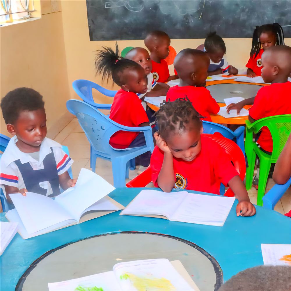 Young learners reading at a classroom table