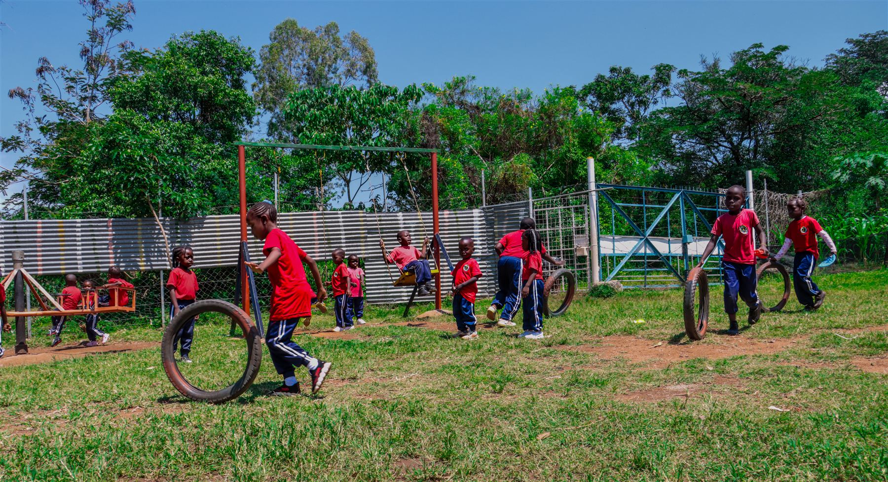 Learners enjoying the swings and playground at break time